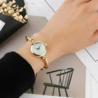 Golden bangle watch