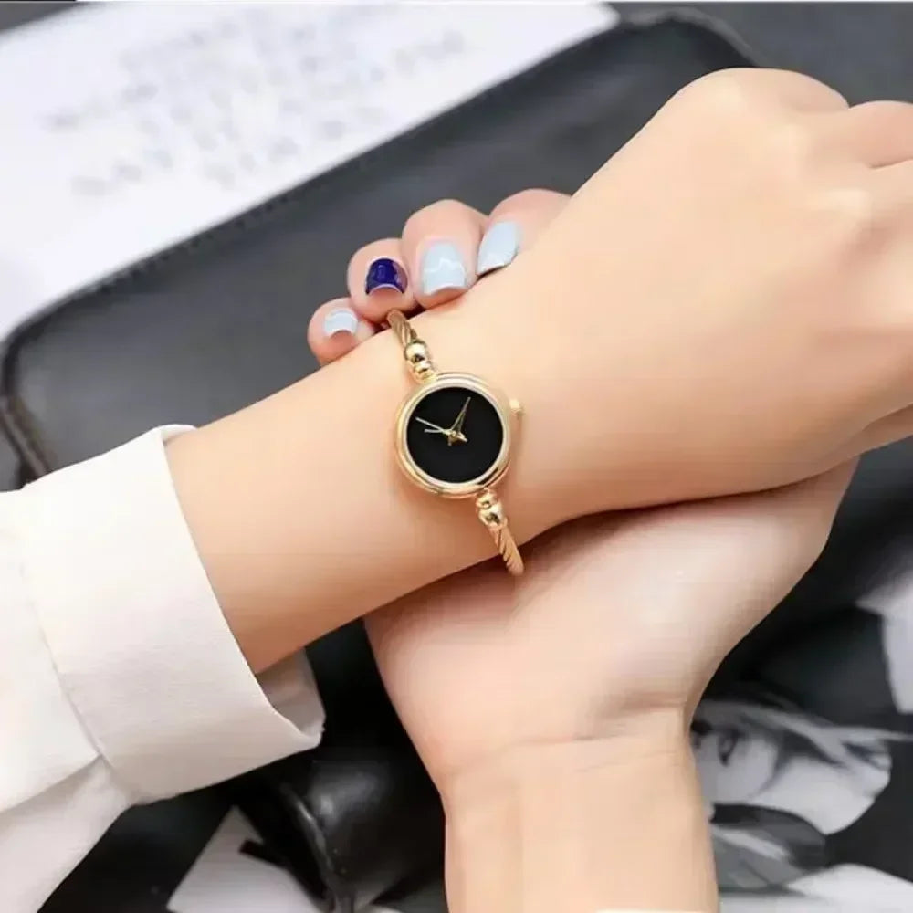 Golden bangle watch