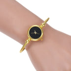 Golden bangle watch