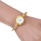 Golden bangle watch