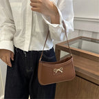 Shoulder bag with bow